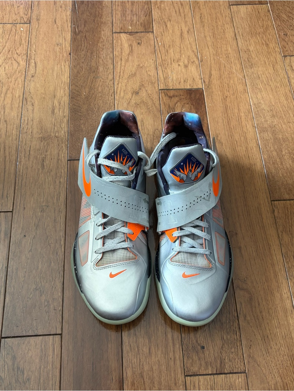 Nike Kids Silver Sneakers with Bright Orange Accents